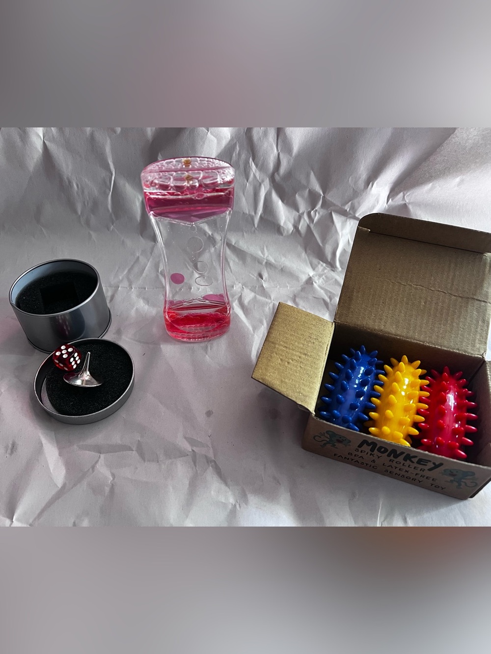 Pink Liquid Motion Timer spinning top and monkey spiky rollers